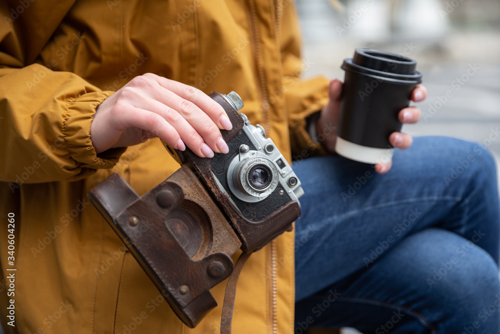 Photo of young tourist girl drinking coffee on streets of Baku. Moody photos of teenager girl visiting city Photo of young tourist girl drinking coffee on streets of Baku. Moody photos of teenager girl visiting city