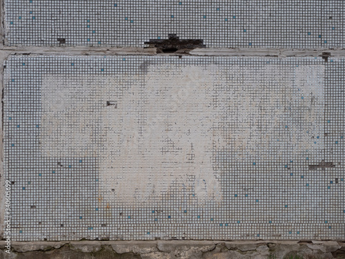 old gray wall with spots of white paint