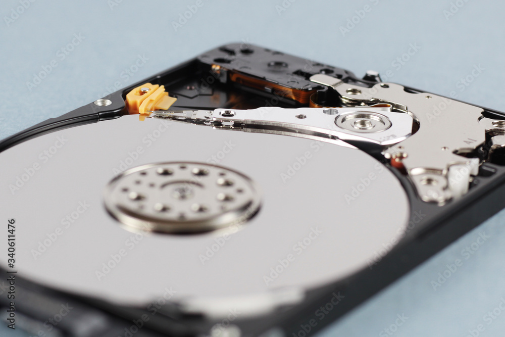 Elements of the inside of a computer hard drive. Side view. Blue background. Elements of the inside of a computer hard drive. Side view. Blue background.