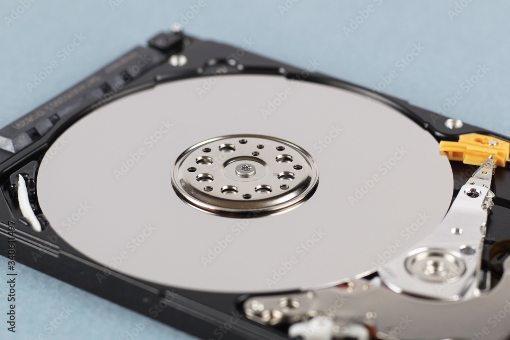 Elements of the inside of a computer hard drive. Side view. Blue background. Elements of the inside of a computer hard drive. Side view. Blue background.