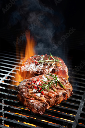 Beef steaks on the grill photo