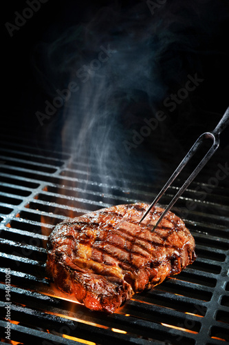 Beef steak on the grill photo