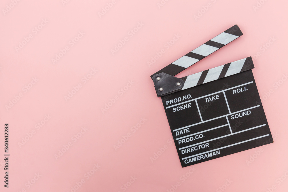 Filmmaker profession. Classic director empty film making clapperboard or movie slate isolated on pink background. Video production film cinema industry concept. Flat lay top view copy space mock up.