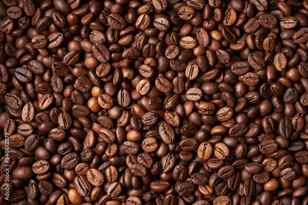 Heap of roasted brown whole coffee beans Heap of roasted brown whole coffee beans