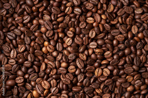 Heap of roasted brown whole coffee beans