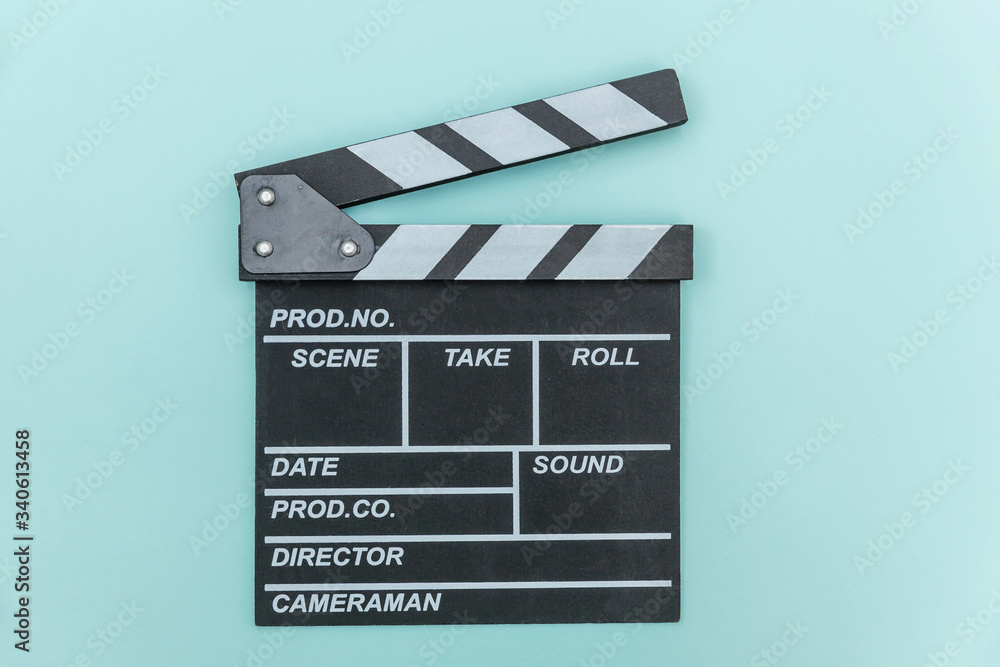 Filmmaker profession. Classic director empty film making clapperboard or movie slate isolated on blue background. Video production film cinema industry concept. Flat lay top view copy space mock up.