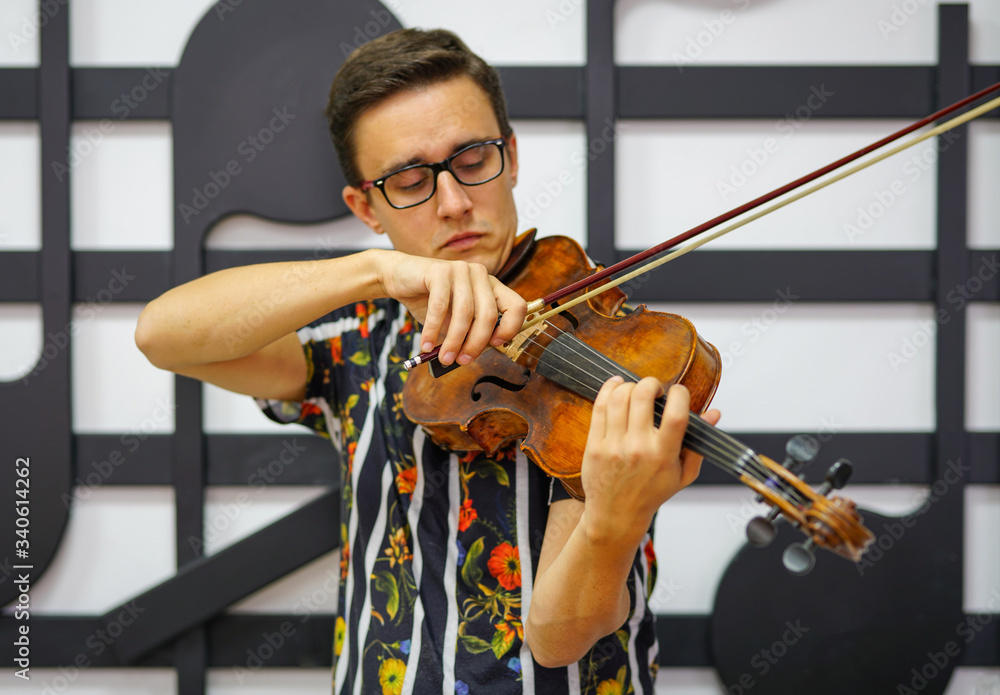 © isayurtsever - Young musician playing the violin, Close Up, Playing his handmade violin with great success