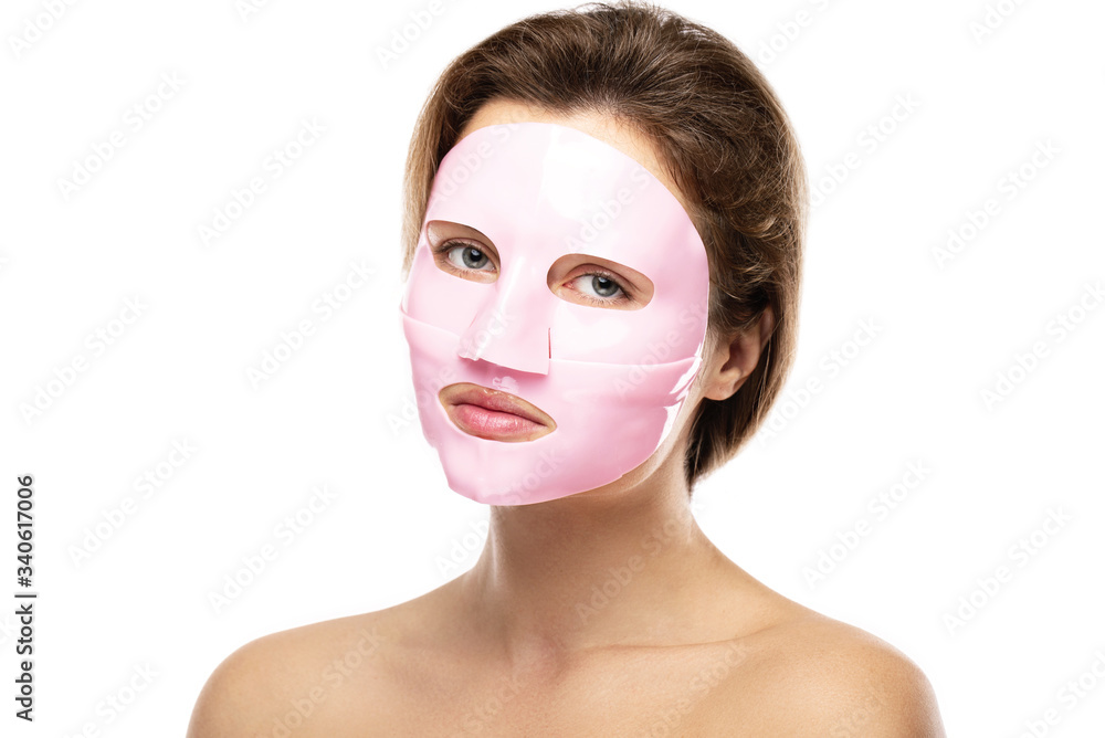 Young beautiful woman with rubber facial mask on her face Young beautiful woman with rubber facial mask on her face