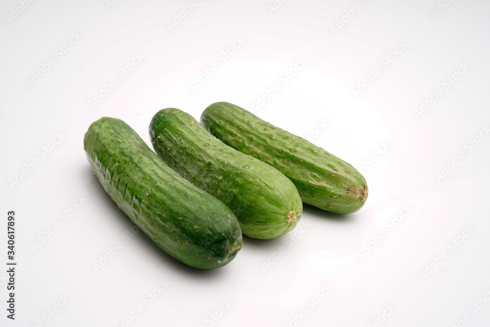 crunchy mini cucumber on white isolated background crunchy mini cucumber on white isolated background