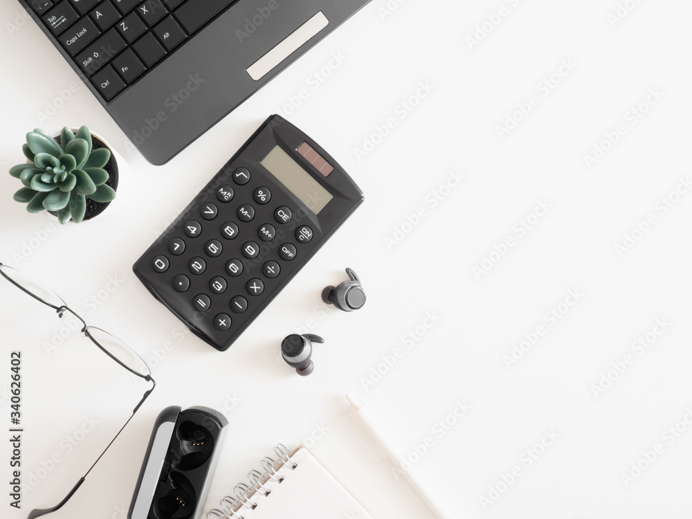 top view of work from home concept with keyboard, calculator and notebook on white background, graphic designer, Creative Designer concept. top view of work from home concept with keyboard, calculator and notebook on white background, graphic designer, Creative Designer concept.
