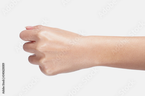 a moist, slender hand with a fist.