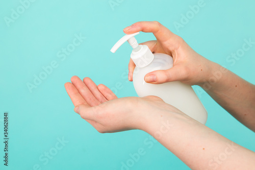 Hygiene concept. Closeup picture of woman's hands in a soap and sanitiser