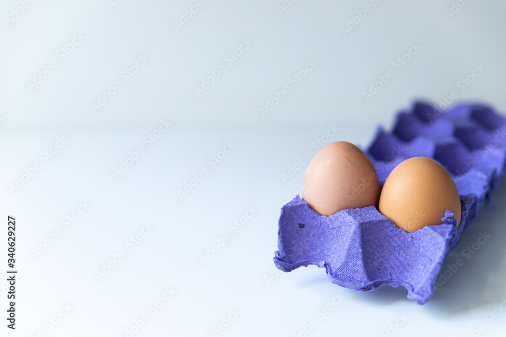 Eggs in a cardboard stand on a white background Eggs in a cardboard stand on a white background
