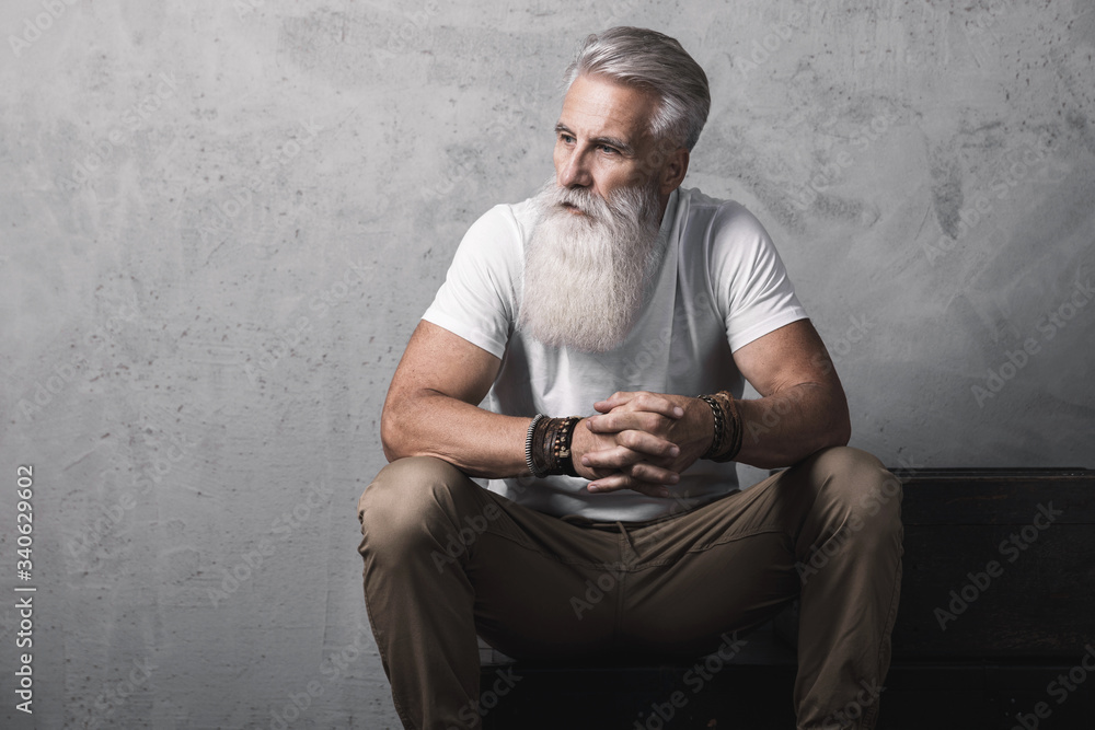 Handsome bearded senior man posing in studio Handsome bearded senior man posing in studio