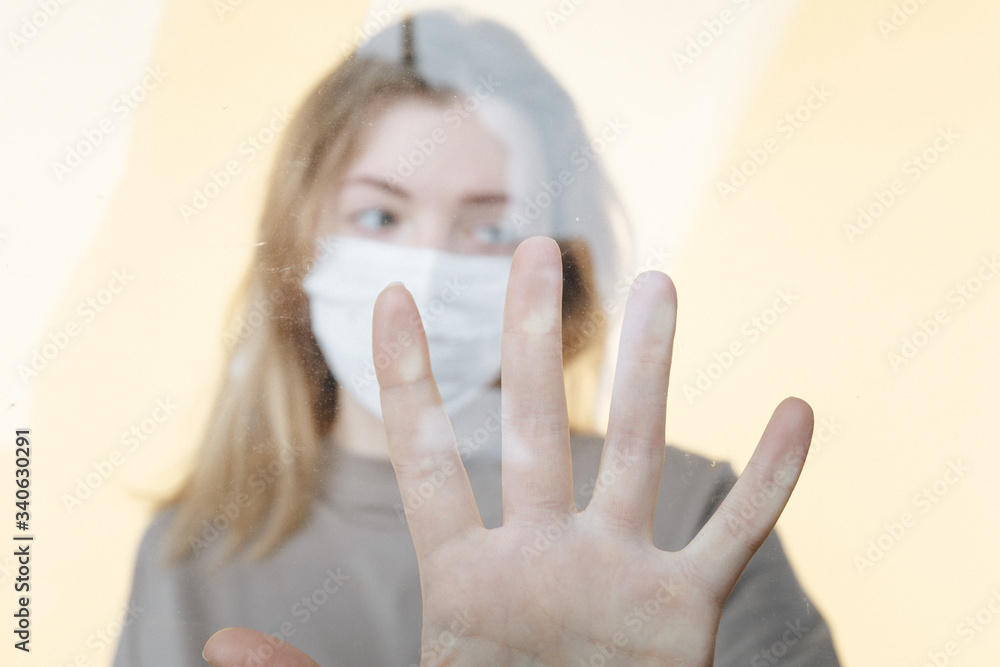 Stay at home because of covid and quarantine. Young woman alone at home in pandemic situation Stay at home because of covid and quarantine. Young woman alone at home in pandemic situation