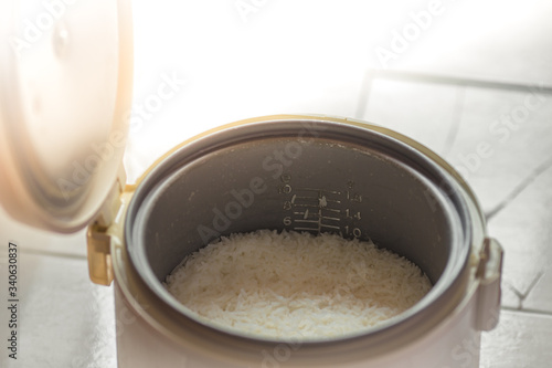The blurred background of the smoke rising out of the rice cooker, the aroma of food fragrance, seen from the cooking in a condo or house.