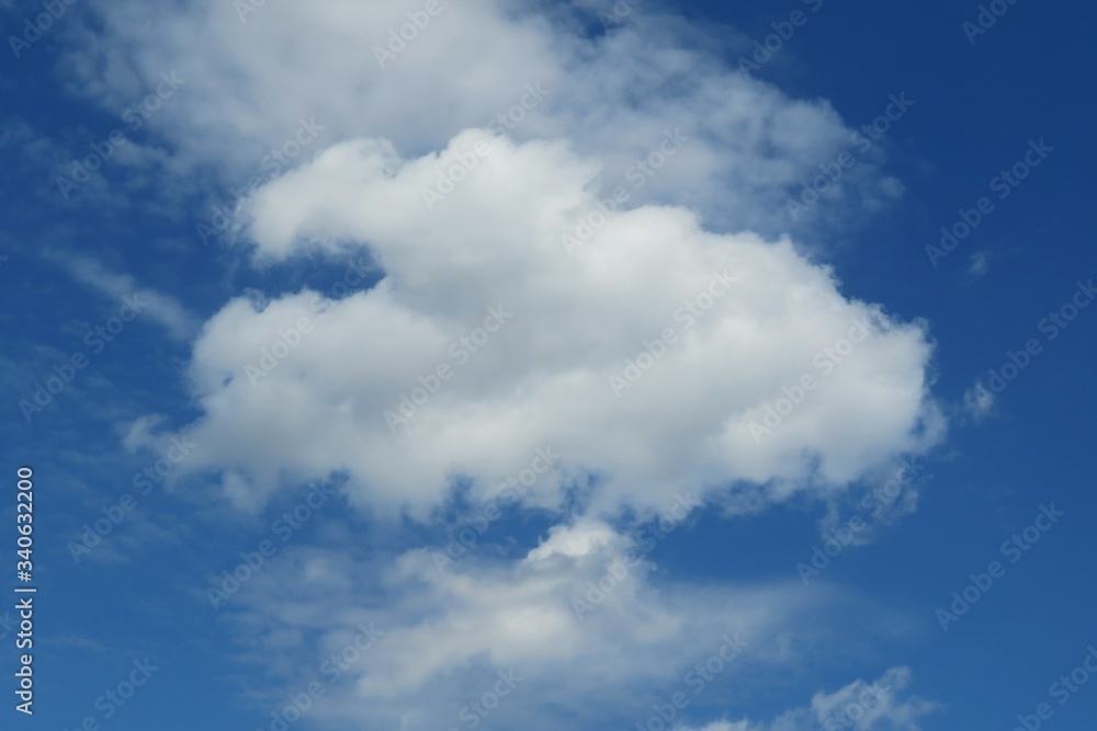 Fluffy cloud in blue sky, natural background Fluffy cloud in blue sky, natural background