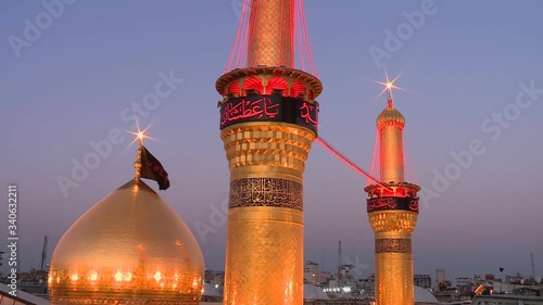 Karbala, Iraq. View of the golden towers, domes of the mosque. The shrine of Imam Abbas in Karbala, Iraq photo