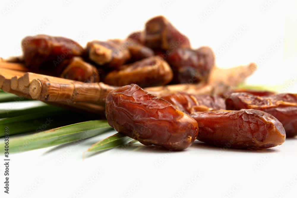 dates fruit whit leaves isolated on white background