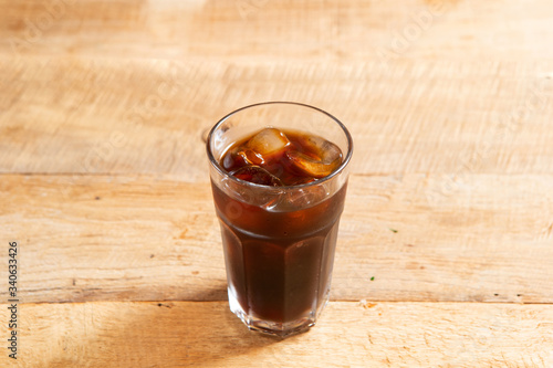 Iced coffee on wooden background 