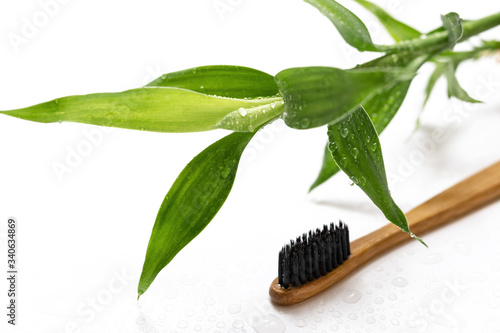 Bamboo toothbrush on white background