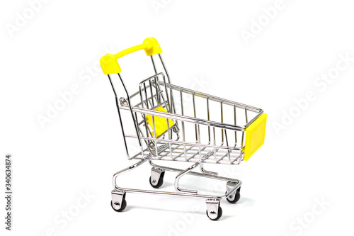 Yellow shopping cart on white background
