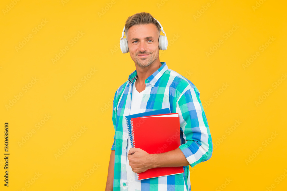 Free courses. Audio courses. Learning english. Modern technology. Audio book concept. Worldwide knowledge access. Audio library. Man handsome student wear headphones hold books. Study languages Free courses. Audio courses. Learning english. Modern technology. Audio book concept. Worldwide knowledge access. Audio library. Man handsome student wear headphones hold books. Study languages