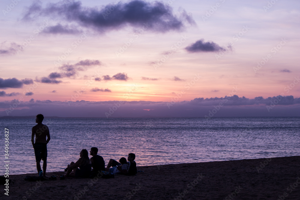 Silhouette of a group of friends by the beach Silhouette of a group of friends by the beach