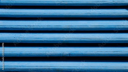 Background of close up mediterranean vintage blue wooden window shutter