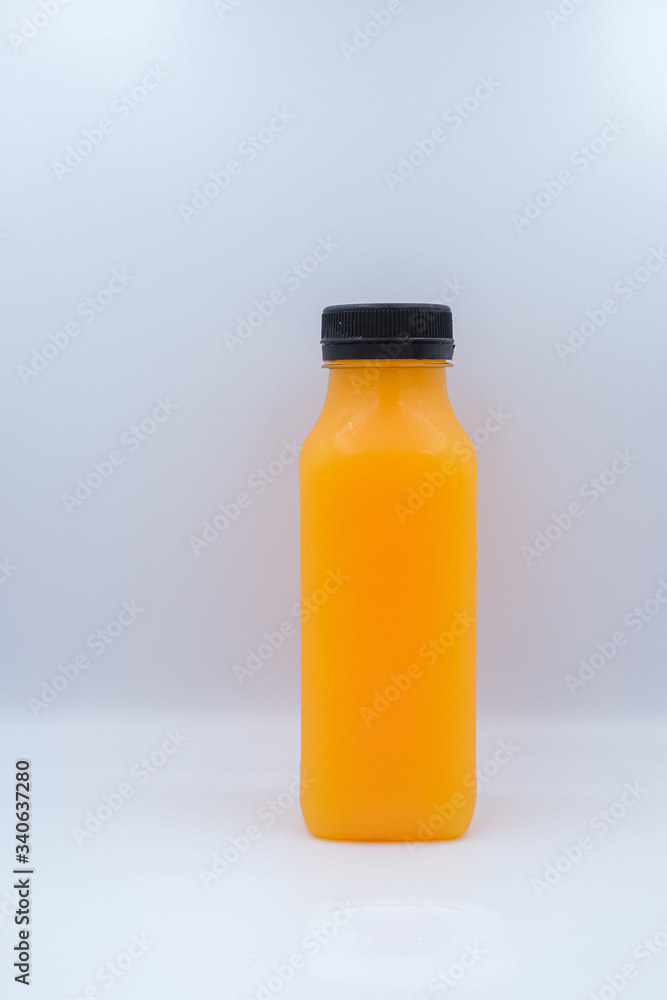 Front view of orange juice glass bottle isolated on white background Front view of orange juice glass bottle isolated on white background