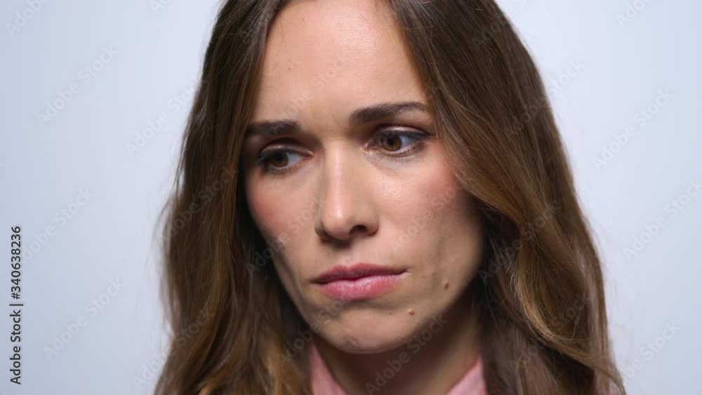 Portrait of sad woman looking to camera. Worried woman face Portrait of sad woman looking to camera. Worried woman face