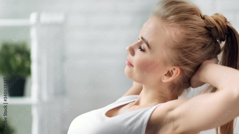 Adorable girl sit hold hands behind head feeling pleasure. Medium close up shot on 4k RED camera Adorable girl sit hold hands behind head feeling pleasure. Medium close up shot on 4k RED camera