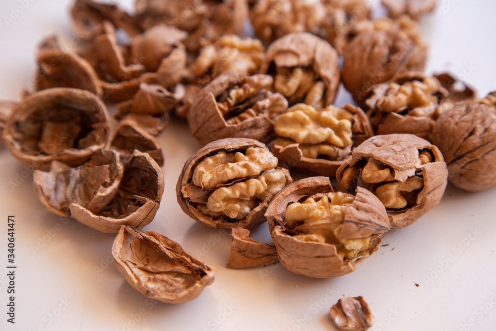 pilled walnut isolated on white background. Composition from nuts on the white isolated background pilled walnut isolated on white background. Composition from nuts on the white isolated background