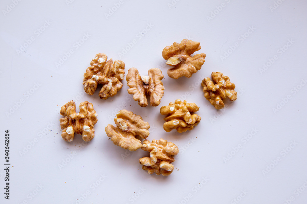 pilled walnut isolated on white background. Composition from nuts on the white isolated background pilled walnut isolated on white background. Composition from nuts on the white isolated background