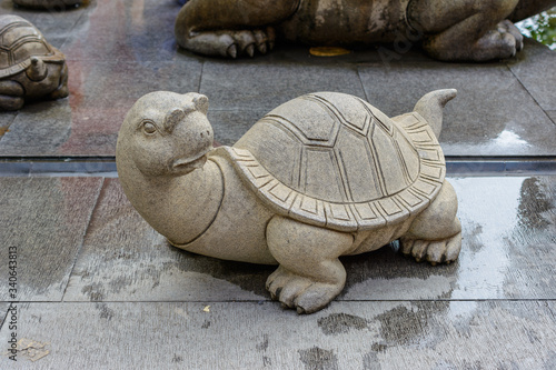 Patterned stone turtle on the territory of Buddhist center Nanshan.