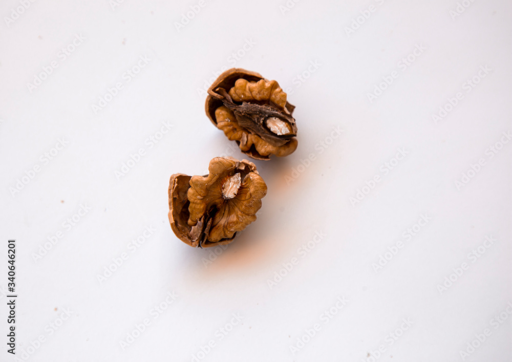 pilled walnut isolated on white background. Composition from nuts on the white isolated background pilled walnut isolated on white background. Composition from nuts on the white isolated background