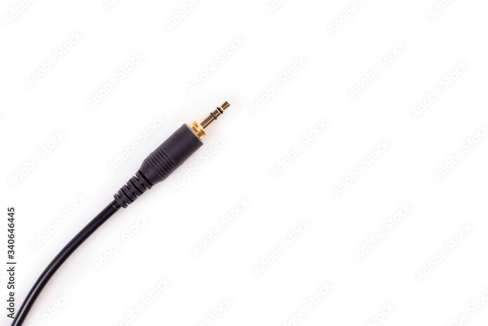 Close up of fingers holding a 3.5mm audio jack Close up of fingers holding a 3.5mm audio jack