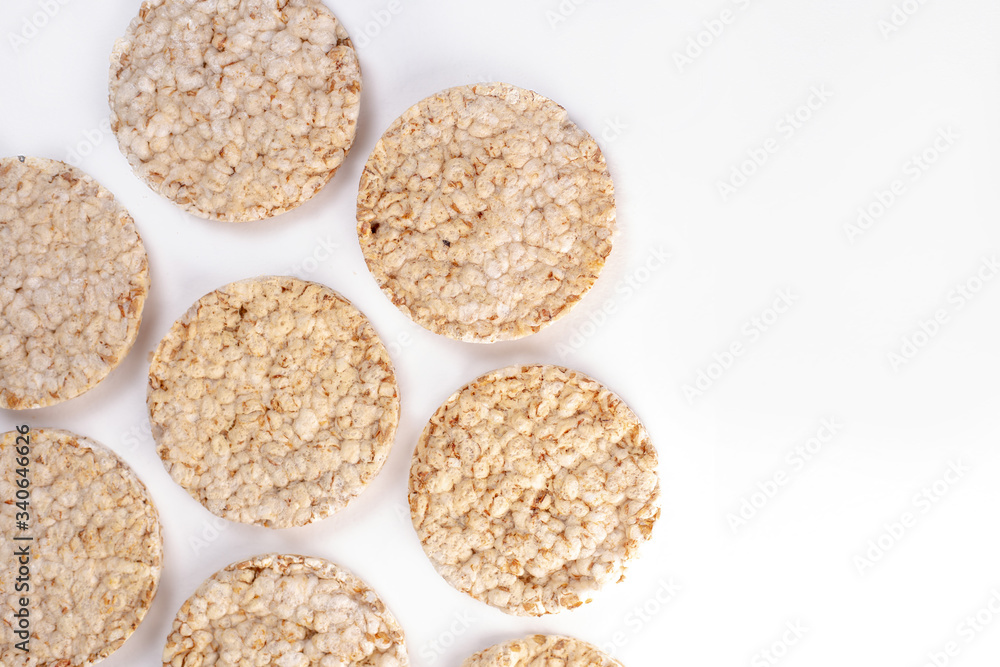Puffed rice cakes on white background. Flat lay, top view. Rice waffle. copy space Puffed rice cakes on white background. Flat lay, top view. Rice waffle. copy space