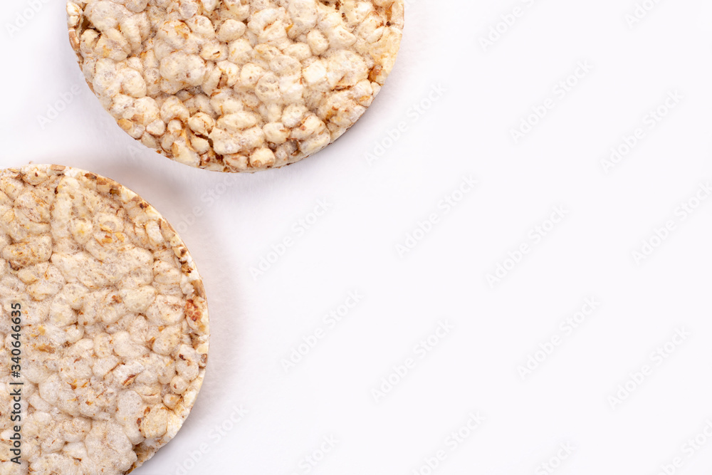 Puffed rice cakes on white background. Flat lay, top view. Rice waffle. copy space Puffed rice cakes on white background. Flat lay, top view. Rice waffle. copy space