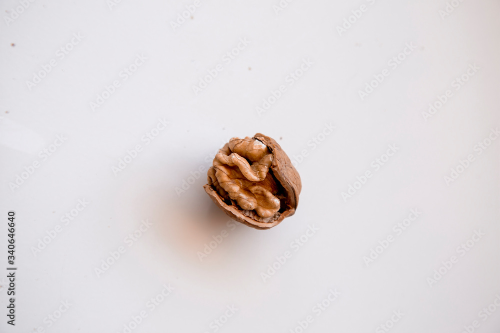 pilled walnut isolated on white background. Composition from nuts on the white isolated background pilled walnut isolated on white background. Composition from nuts on the white isolated background