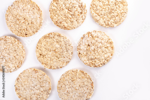 Puffed rice cakes on white background. Flat lay, top view. Rice waffle. copy space