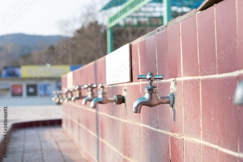 Wallpaper Mural Public outdoor faucets at camp site. Closeup shot. Torontodigital.ca
