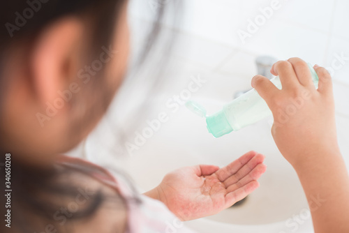 coronavirus pandemic prevention little asian girl is wash hands with soap warm water and rubbing nails and fingers washing frequently or using hand sanitizer gel. hygiene concept hand detail..