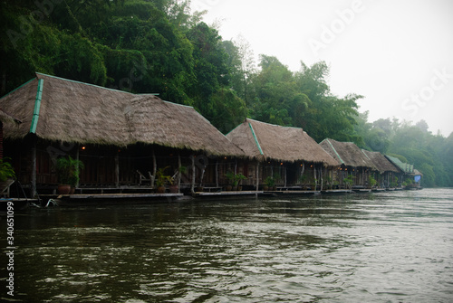Floating wooden hotel on the river Kwai misty morning