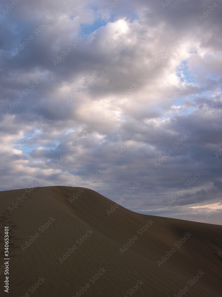 Beautiful view of the dunes in Maspalomas beach during the sunset. South of Gran Canaria Island. Spain.
