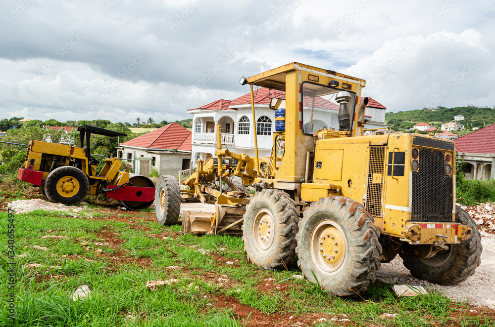 Parked Motor Grader And Road Roller Parked Motor Grader And Road Roller