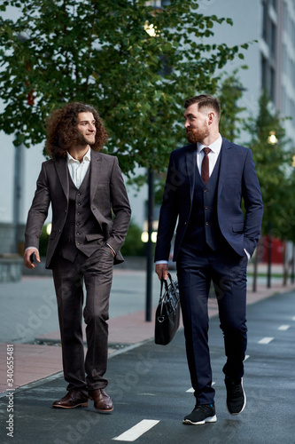 Attractive bearded young men in classic suit with bag. Elegancy and male style
