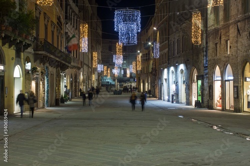 Corso Vannucci main street in Perugia city centre at night time © greta gabaglio
