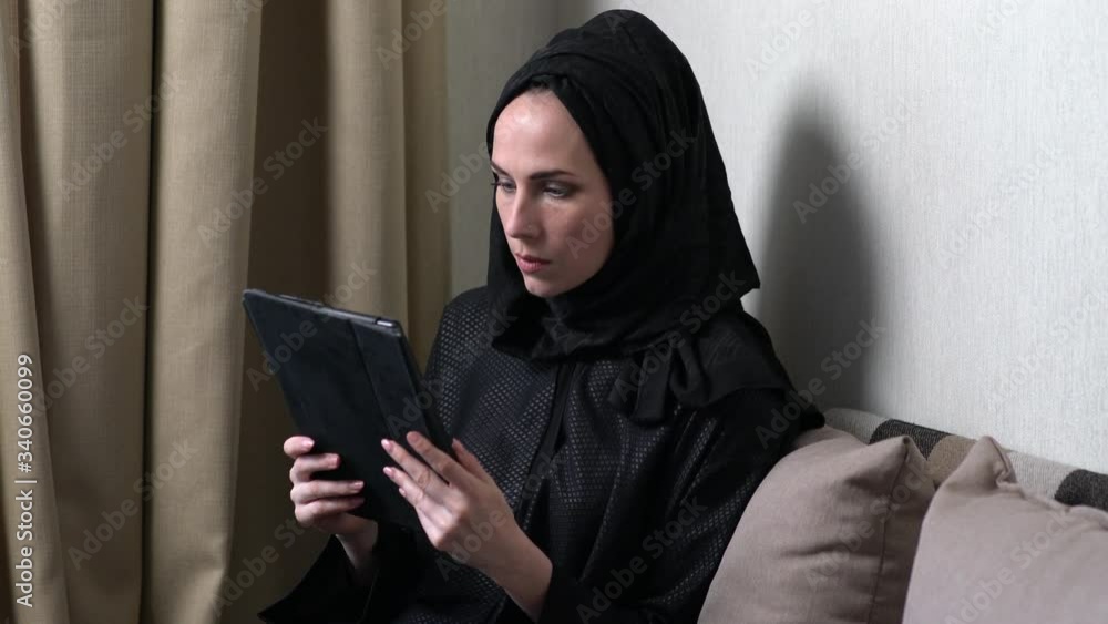 Young asian muslim woman in head scarf smile. Beautiful middle eastern woman wearing abaya. Arabian woman with happy smile. Playing with mabile phone. Young asian muslim woman in head scarf smile. Beautiful middle eastern woman wearing abaya. Arabian woman with happy smile. Playing with mabile phone.