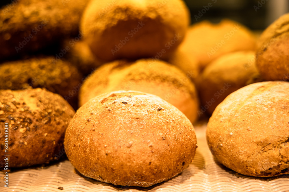 Pile of rustic bread in a bakery. Sourdough bread. Multi-grain bread. Whole wheat bread. Background of rustic bread.
Pile of rustic bread in a bakery. Sourdough bread. Multi-grain bread. Whole wheat bread. Background of rustic bread.